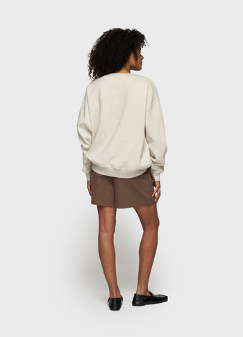 statement sweater logo patch | soft white melee