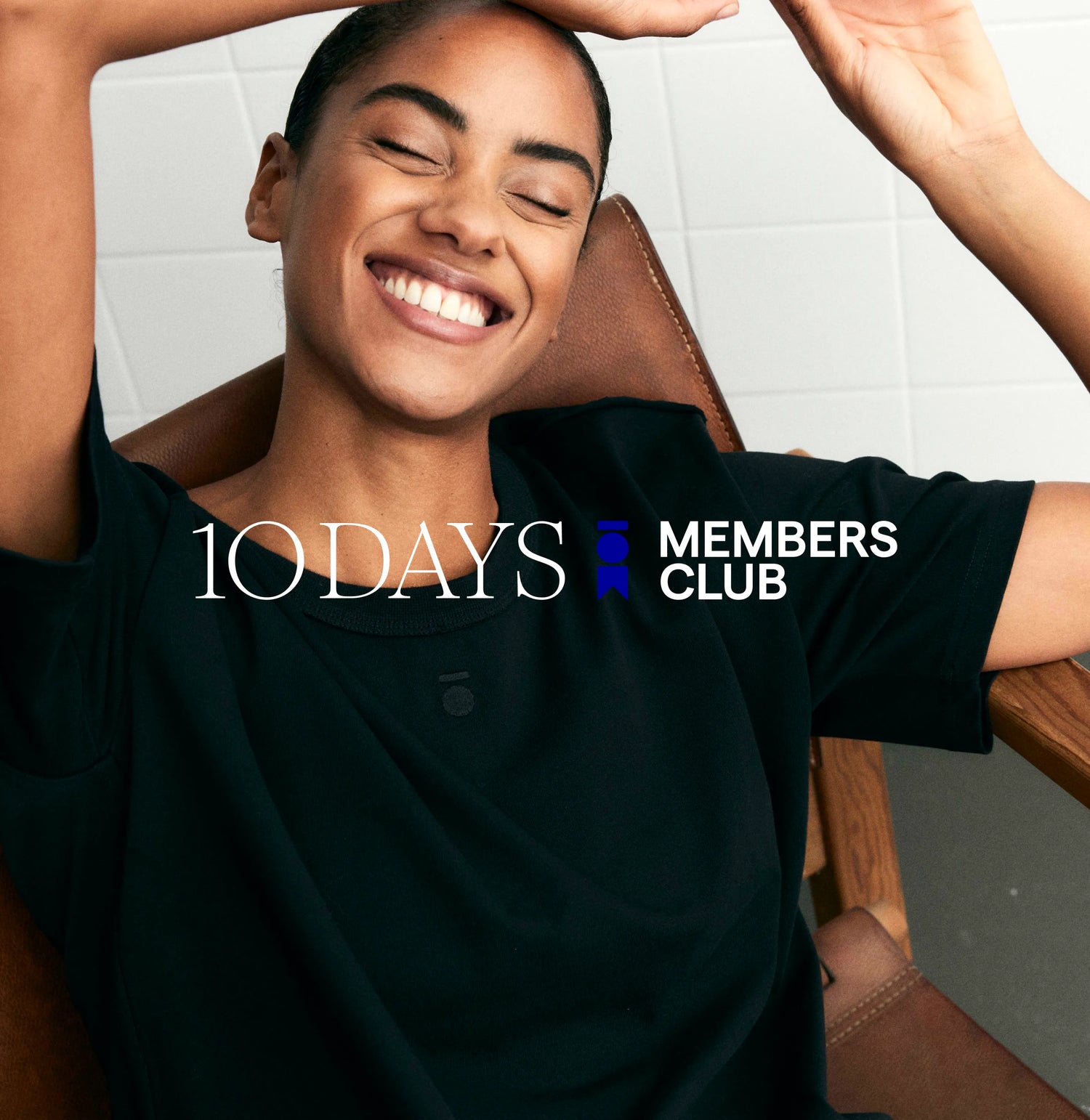 Woman sitting in chair with 10DAYS Members Club text overlay