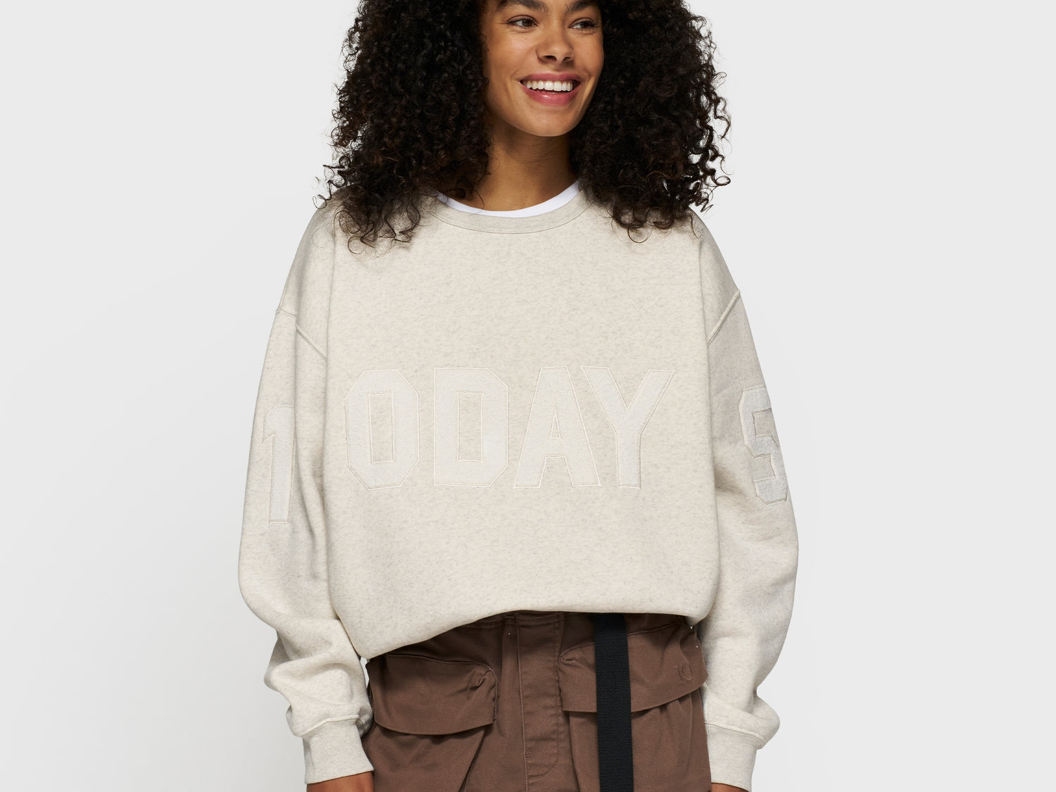 statement sweater logo patch | soft white melee