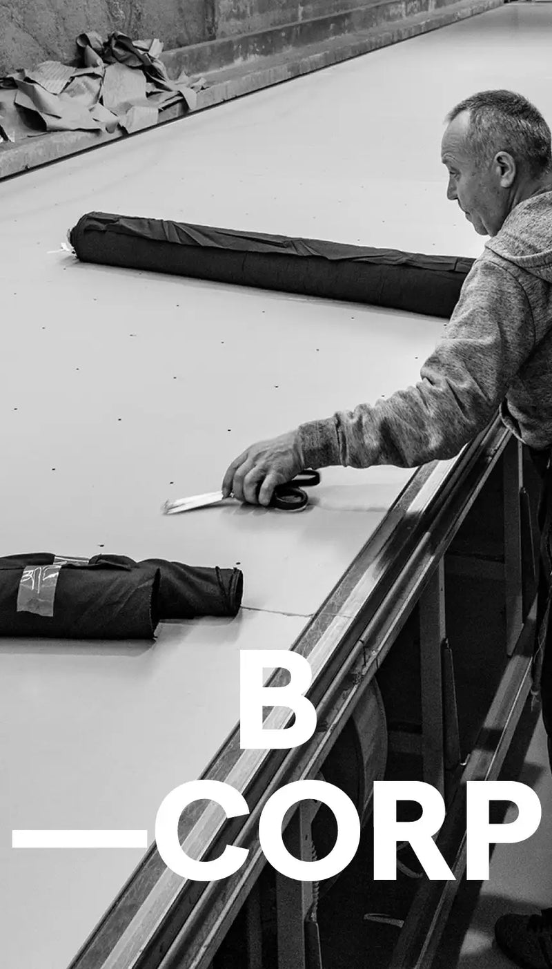 10DAYS for Good - B Corp: Man in factory preparing fabrics