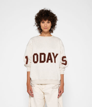 statement sweater logo | soft white melee