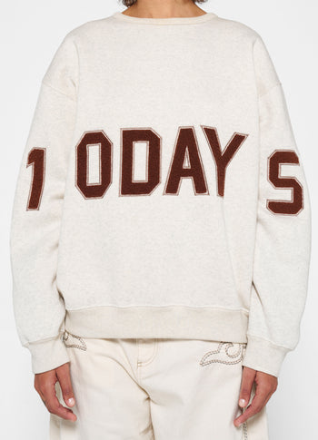 statement sweater logo | soft white melee