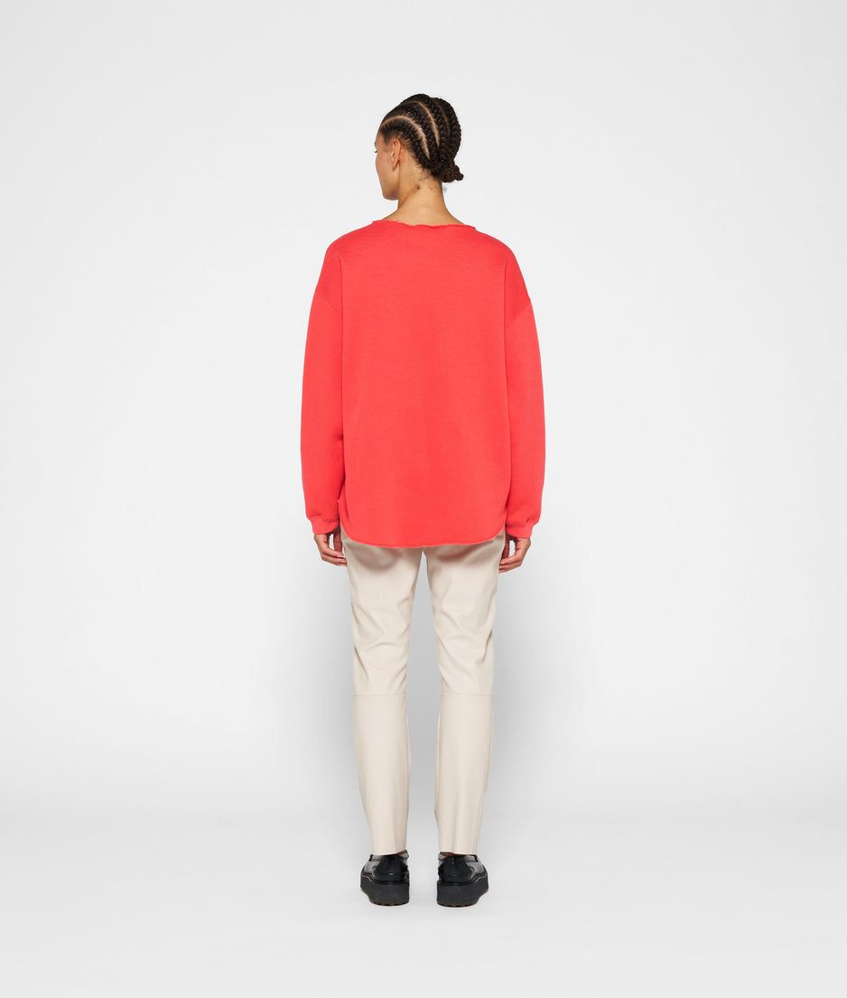raw edge statement sweater | coral red